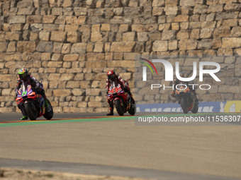 Franco Morbidelli (Ita-Pramac Racing Ducati), Francesco Bagnaia (Ita-Ducati Lenovo Team), and Brad Binder (Saf-Red Bull KTM Factory Racing)...