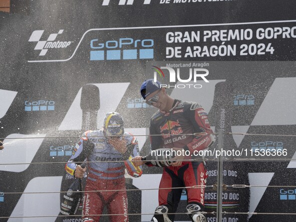 Pedro Acosta (31) of GASGAS Factory Racing and Marc Marquez (93) of Gresini Racing Ducati participate in the Moto Grand Prix GoPro of Aragon...