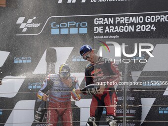 Pedro Acosta (31) of GASGAS Factory Racing and Marc Marquez (93) of Gresini Racing Ducati participate in the Moto Grand Prix GoPro of Aragon...