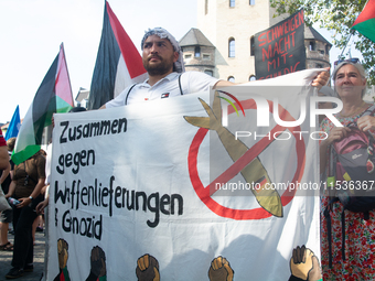 A few hundred people take part in an anti-war demonstration against government policy toward the war and demand peace in Cologne, Germany, o...