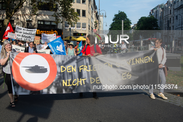 A few hundred people take part in an anti-war demonstration against government policy toward the war and demand peace in Cologne, Germany, o...