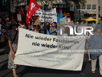 A few hundred people take part in an anti-war demonstration against government policy toward the war and demand peace in Cologne, Germany, o...