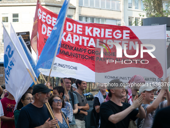 A few hundred people take part in an anti-war demonstration against government policy toward the war and demand peace in Cologne, Germany, o...