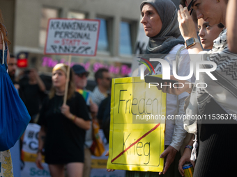 A few hundred people take part in an anti-war demonstration against government policy toward the war and demand peace in Cologne, Germany, o...