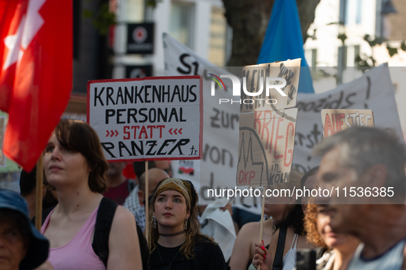 A few hundred people take part in an anti-war demonstration against government policy toward the war and demand peace in Cologne, Germany, o...