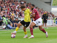 Burton Albion's Tomas Kalinauskas is challenged by Northampton Town's Ali Koiki during the first half of the Sky Bet League 1 match between...