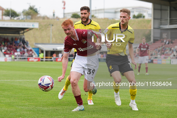 Liam McCarron of Northampton Town and Jack Armer of Burton Albion get confrontational during the second half of the Sky Bet League 1 match b...