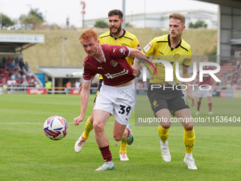 Liam McCarron of Northampton Town and Jack Armer of Burton Albion get confrontational during the second half of the Sky Bet League 1 match b...