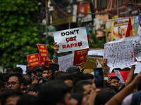 Students and citizens hold various posters during a rally in Kolkata, India, on September 1, 2024, demanding punishment for the accused invo...