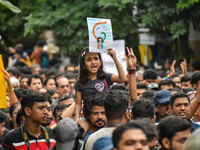 Students and citizens hold various posters during a rally in Kolkata, India, on September 1, 2024, demanding punishment for the accused invo...