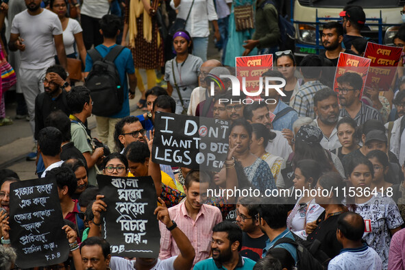 Students and citizens hold various posters during a rally in Kolkata, India, on September 1, 2024, demanding punishment for the accused invo...