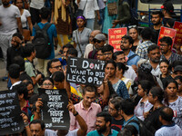 Students and citizens hold various posters during a rally in Kolkata, India, on September 1, 2024, demanding punishment for the accused invo...