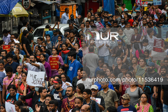 Students and citizens hold various posters during a rally in Kolkata, India, on September 1, 2024, demanding punishment for the accused invo...