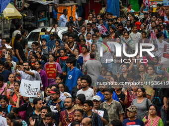 Students and citizens hold various posters during a rally in Kolkata, India, on September 1, 2024, demanding punishment for the accused invo...