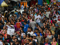 Students and citizens hold various posters during a rally in Kolkata, India, on September 1, 2024, demanding punishment for the accused invo...