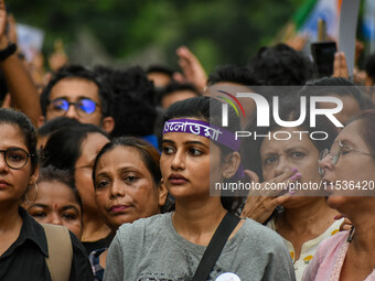 Students and citizens hold various posters during a rally in Kolkata, India, on September 1, 2024, demanding punishment for the accused invo...