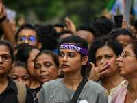 Students and citizens hold various posters during a rally in Kolkata, India, on September 1, 2024, demanding punishment for the accused invo...