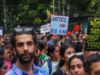 Students and citizens hold various posters during a rally in Kolkata, India, on September 1, 2024, demanding punishment for the accused invo...