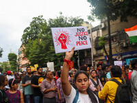 Students and citizens hold various posters during a rally in Kolkata, India, on September 1, 2024, demanding punishment for the accused invo...