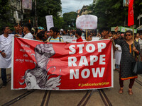 Students and citizens hold various posters during a rally in Kolkata, India, on September 1, 2024, demanding punishment for the accused invo...