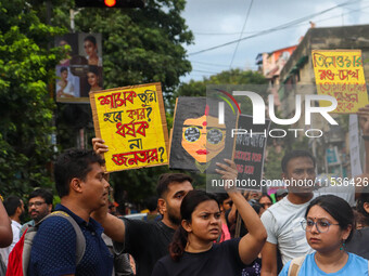 Students and citizens hold various posters during a rally in Kolkata, India, on September 1, 2024, demanding punishment for the accused invo...