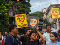 Students and citizens hold various posters during a rally in Kolkata, India, on September 1, 2024, demanding punishment for the accused invo...