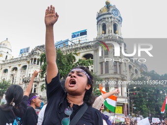 Students shout slogans during a rally in Kolkata, India, on September 1, 2024, demanding punishment for the accused involved in the rape and...