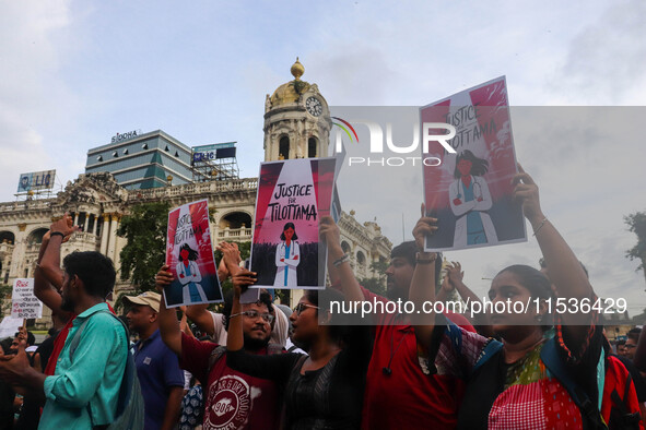 Students and citizens hold various posters during a rally in Kolkata, India, on September 1, 2024, demanding punishment for the accused invo...