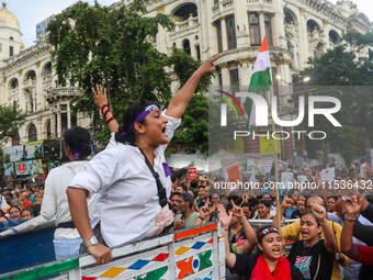 Students shout slogans during a rally in Kolkata, India, on September 1, 2024, demanding punishment for the accused involved in the rape and...