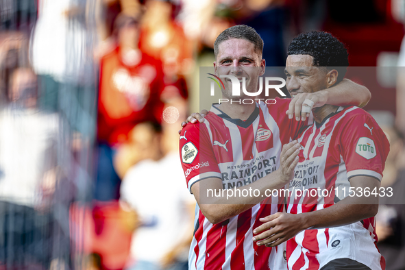 PSV player Malik Tillman and PSV player Joey Veerman celebrate the goal during the match between PSV and Go Ahead Eagles at the Philips Stad...