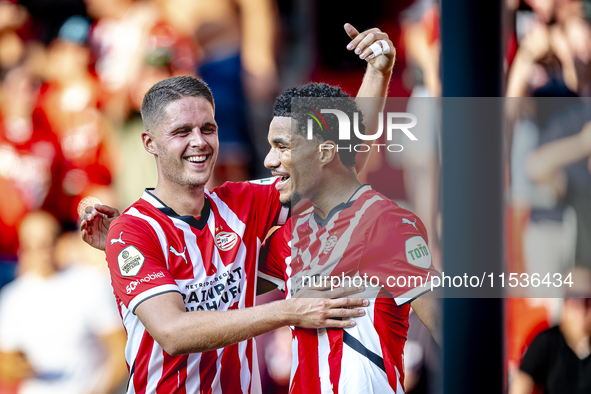 PSV player Malik Tillman and PSV player Joey Veerman celebrate the goal during the match between PSV and Go Ahead Eagles at the Philips Stad...