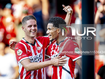 PSV player Malik Tillman and PSV player Joey Veerman celebrate the goal during the match between PSV and Go Ahead Eagles at the Philips Stad...