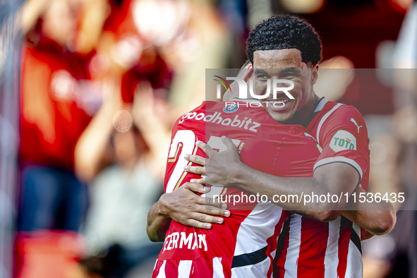 PSV player Malik Tillman and PSV player Joey Veerman celebrate the goal during the match between PSV and Go Ahead Eagles at the Philips Stad...