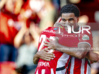 PSV player Malik Tillman and PSV player Joey Veerman celebrate the goal during the match between PSV and Go Ahead Eagles at the Philips Stad...