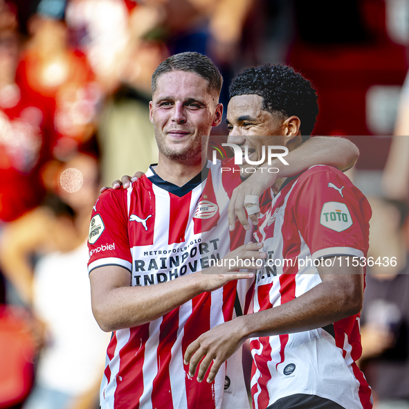 PSV player Malik Tillman and PSV player Joey Veerman celebrate the goal during the match between PSV and Go Ahead Eagles at the Philips Stad...