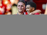 PSV player Malik Tillman and PSV player Joey Veerman celebrate the goal during the match between PSV and Go Ahead Eagles at the Philips Stad...