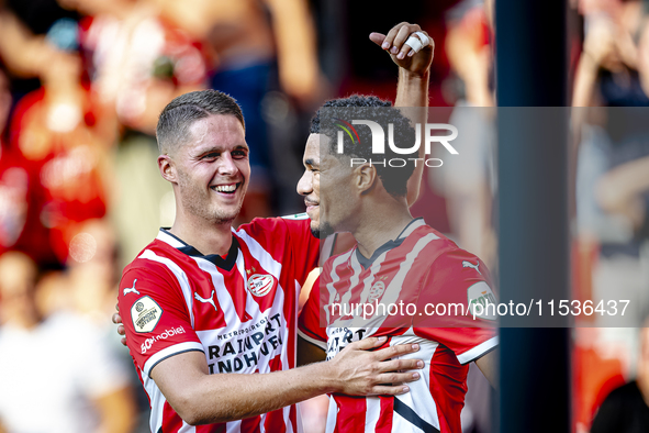 PSV player Malik Tillman and PSV player Joey Veerman celebrate the goal during the match between PSV and Go Ahead Eagles at the Philips Stad...