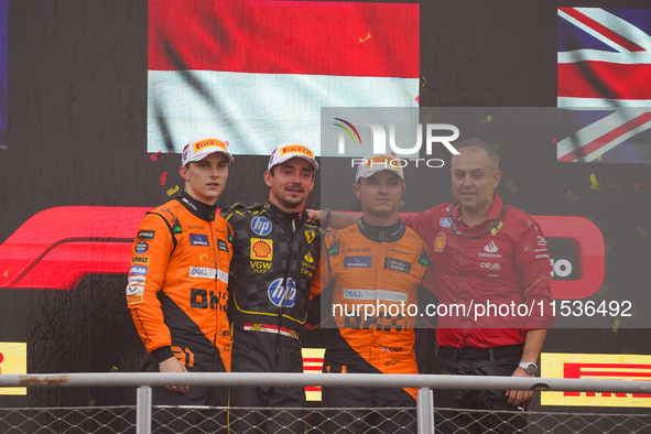 Charles Leclerc of Monaco drives the (16) Scuderia Ferrari SF-24 Ferrari, Oscar Piastri of Australia drives the (81) McLaren F1 Team MCL38 M...