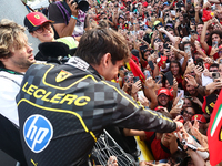 Charles Leclerc of Ferrari celebrates with fans after the Formula 1 Italian Grand Prix at Autodromo Nazionale di Monza in Monza, Italy on Se...