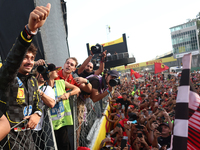 Charles Leclerc of Ferrari celebrates with fans after the Formula 1 Italian Grand Prix at Autodromo Nazionale di Monza in Monza, Italy on Se...