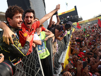 Charles Leclerc of Ferrari celebrates with fans after the Formula 1 Italian Grand Prix at Autodromo Nazionale di Monza in Monza, Italy on Se...