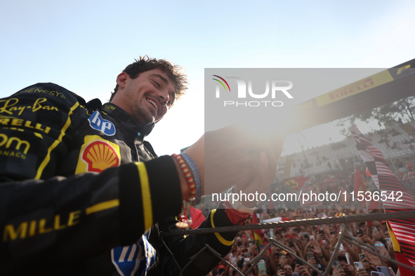 Charles Leclerc of Ferrari celebrates after the Formula 1 Italian Grand Prix at Autodromo Nazionale di Monza in Monza, Italy on September 1,...