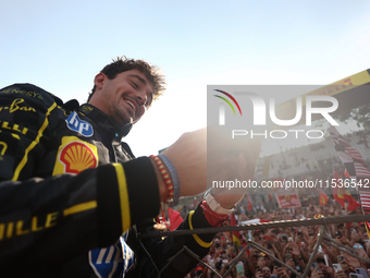 Charles Leclerc of Ferrari celebrates after the Formula 1 Italian Grand Prix at Autodromo Nazionale di Monza in Monza, Italy on September 1,...