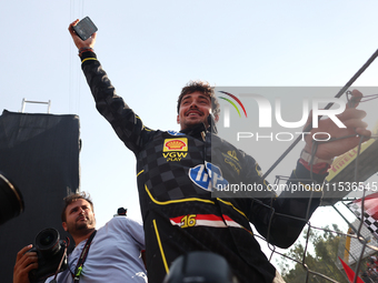 Charles Leclerc of Ferrari celebrates after the Formula 1 Italian Grand Prix at Autodromo Nazionale di Monza in Monza, Italy on September 1,...