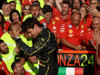 Charles Leclerc of Ferrari celebrates with the team after the Formula 1 Italian Grand Prix at Autodromo Nazionale di Monza in Monza, Italy o...