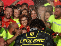 Charles Leclerc of Ferrari celebrates with the team after the Formula 1 Italian Grand Prix at Autodromo Nazionale di Monza in Monza, Italy o...