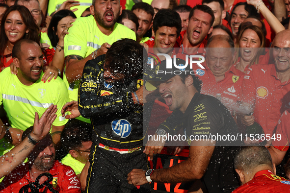 Charles Leclerc, Carlos Sainz of Ferrari and Frederic Vasseur celebrate with the team after the Formula 1 Italian Grand Prix at Autodromo Na...