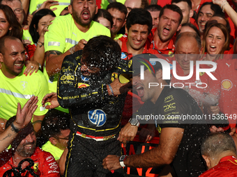 Charles Leclerc, Carlos Sainz of Ferrari and Frederic Vasseur celebrate with the team after the Formula 1 Italian Grand Prix at Autodromo Na...