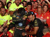 Charles Leclerc, Carlos Sainz of Ferrari and Frederic Vasseur celebrate with the team after the Formula 1 Italian Grand Prix at Autodromo Na...