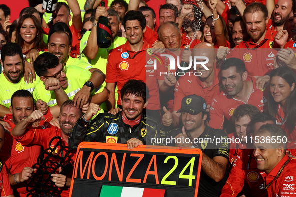 Charles Leclerc, Carlos Sainz of Ferrari and Frederic Vasseur celebrate with the team after the Formula 1 Italian Grand Prix at Autodromo Na...